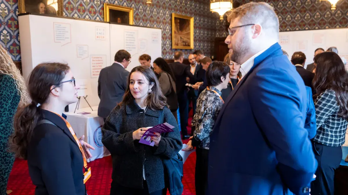 Image of 3 people speaking to each other