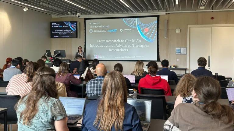 Delegates sitting in a lecture theatre 
