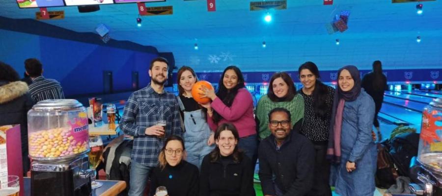 Group photo of lab group members at a bowling alley