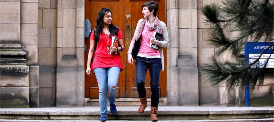 students in front of building