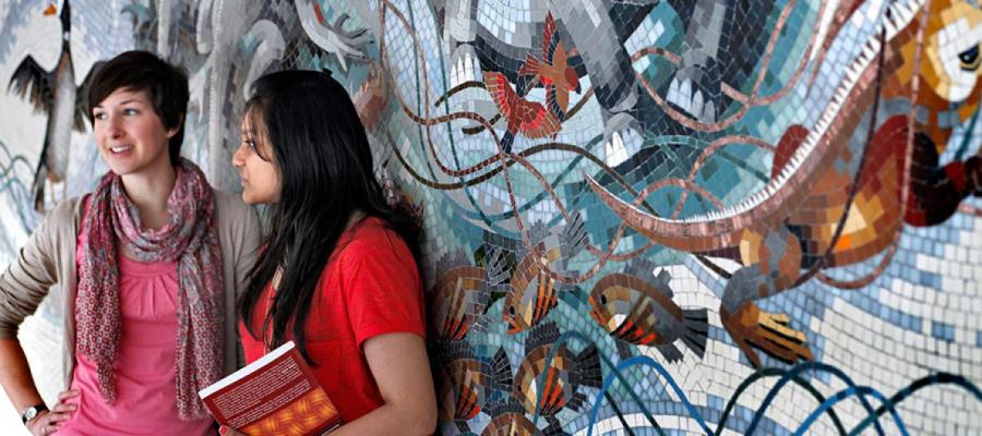 girls in front of wall