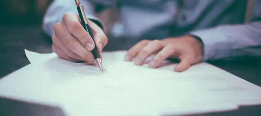Man writes on paper