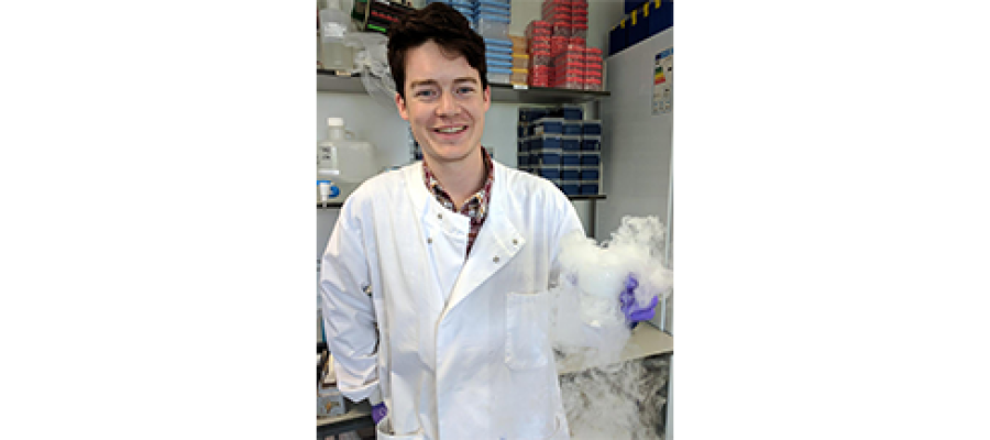 Headshot of Brendan Largley in the lab, smiling.