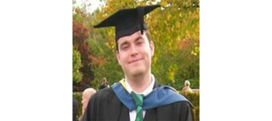 Headshot of Dr. Craig Munns in his graduation cap and gown.