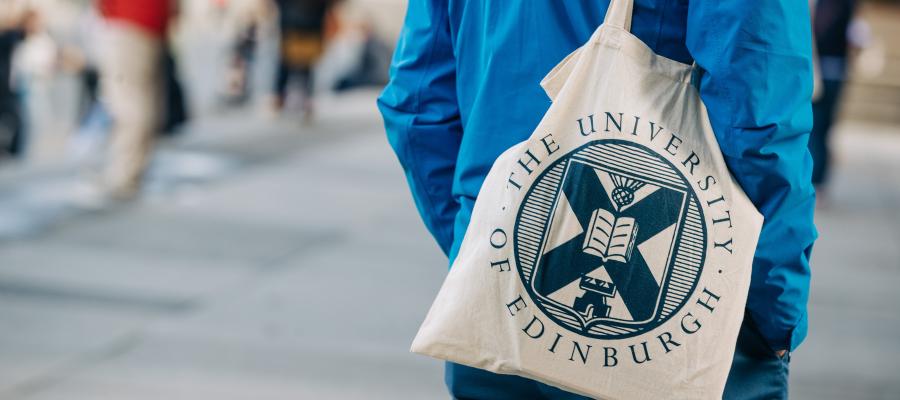 Student with University of Edinburgh tote bag