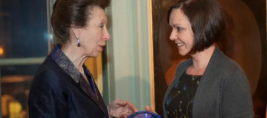 Photo of Louise being presented with the Chancellor’s Rising Star Award by Princess Anne.