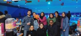 Group photo of lab group members at a bowling alley
