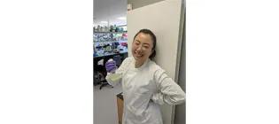 Nuoya Chen standing in the lab and smiling.