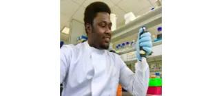 Dr. Christopher Nwankwo working in a lab