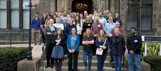 group picture of Hub members gathering outside a Hall