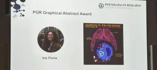 Image of SBS Symposium Award screen showcasing winner Iris Floria