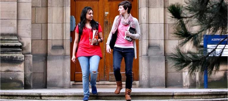 students in front of building