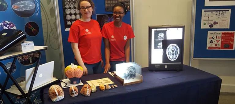 Photo of two group members at the Sci-Fest event