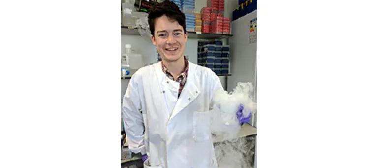 Headshot of Brendan Largley in the lab, smiling.