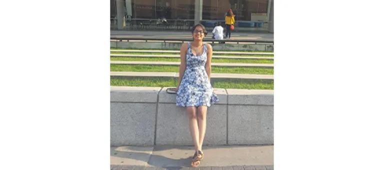 Jovanna Maharaj standing in a dress outside.