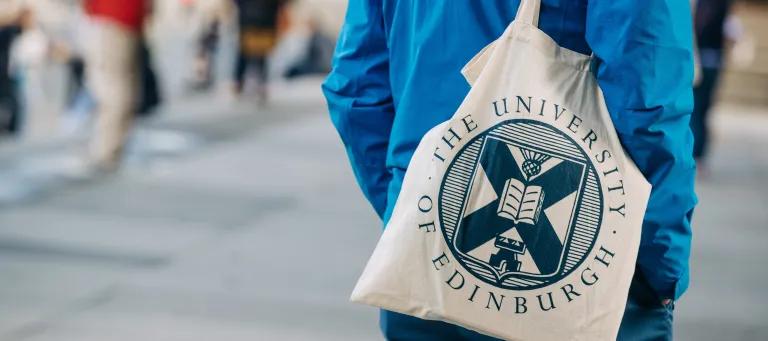 Student with University of Edinburgh tote bag