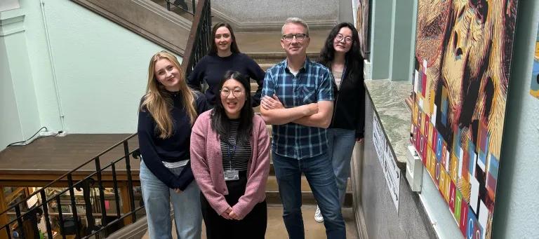 A group of people standing on stairs