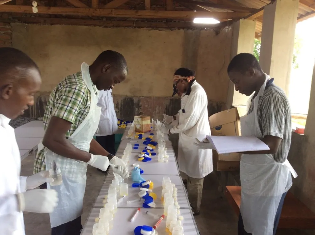 Photo of two healthcare workers hadling samples
