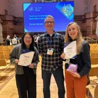A group of people holding certificates.