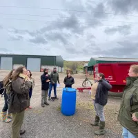 Image of group outside touring farm