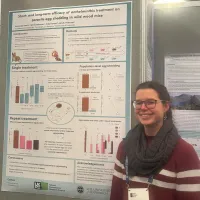 Photo of Alex presenting a poster at the British Ecological Society annual meeting in Edinburgh.