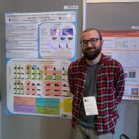 Photo of Andy and presenting a poster at the British Ecological Society annual meeting in Edinburgh.