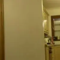 Panorama photo of the group sitting around a table indoors