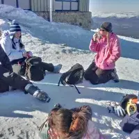 Photo of some group members sitting in the snow