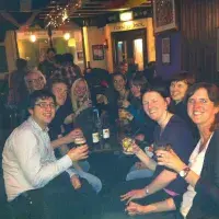 Photo of the lab group sitting with drinks 