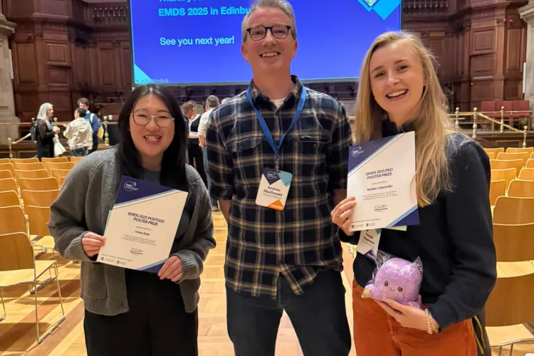 A group of people holding certificates.