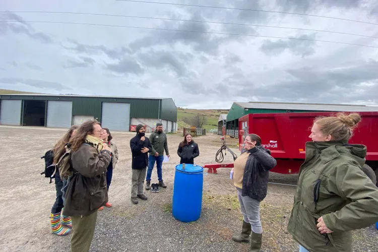 Image of group outside touring farm