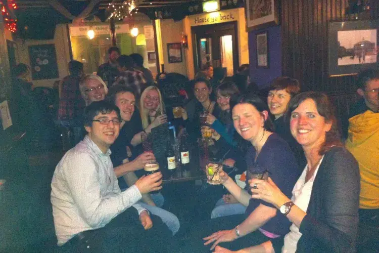 Photo of the lab group sitting with drinks 