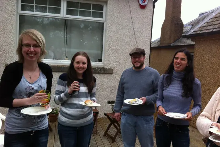 Photo of the lab group sitting with drinks 