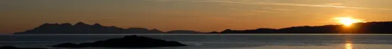 View of the Isle of Rum at sunset.