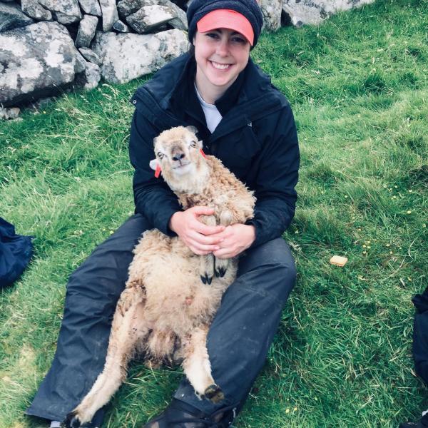 Amy Sweeny holding a Soay sheep.