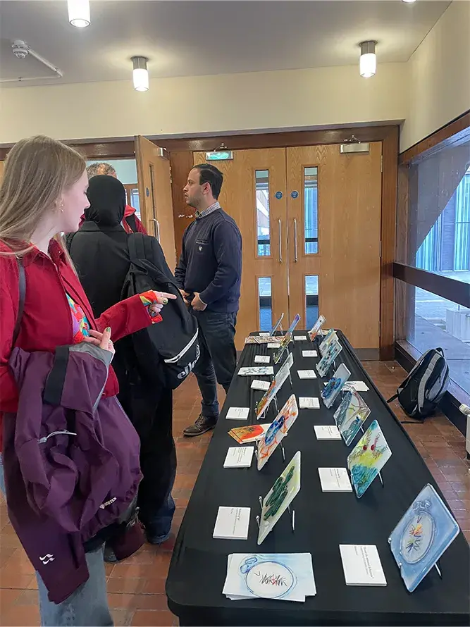 People viewing the tile artworks at the exhibition.