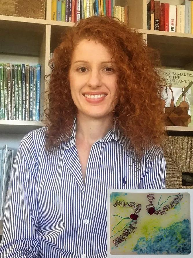 Constandina with her tile artwork "Sibling rivalry".
