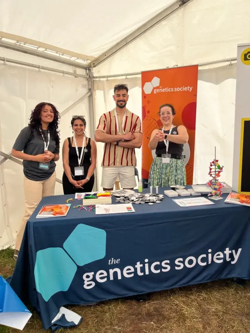 Group member Andra and three others in front of a stall at Lambeth county show