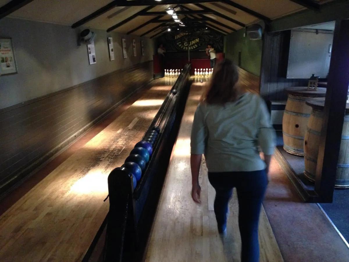A lab group member standing in front of a bowling lane
