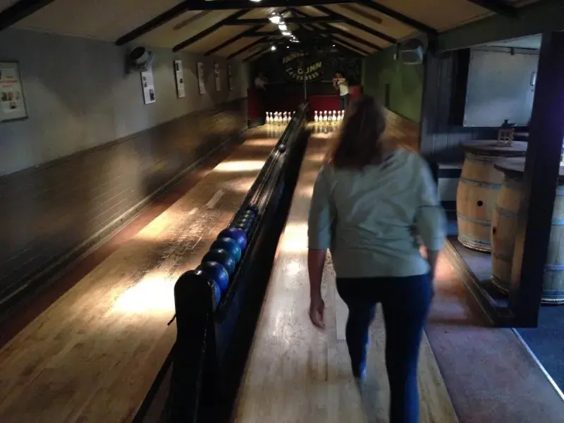 A lab group member standing in front of a bowling lane