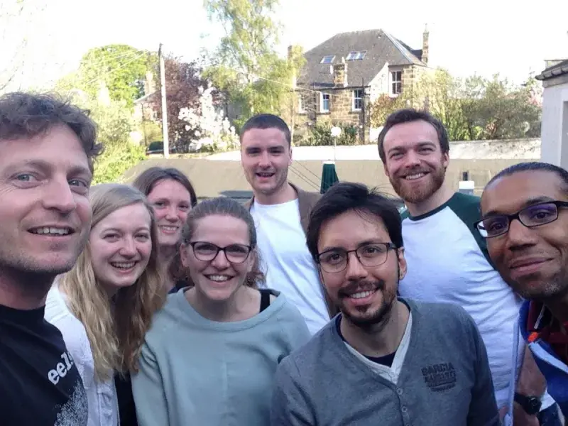 Group photo of the lab members outside the Sheep's Heid smiling for the camera