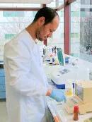 Dr. Alejandro Salinas Vaccaro working in the lab.