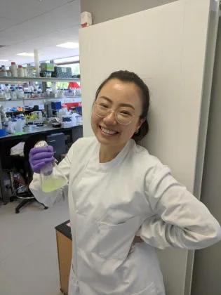Nuoya Chen in the lab, smiling.