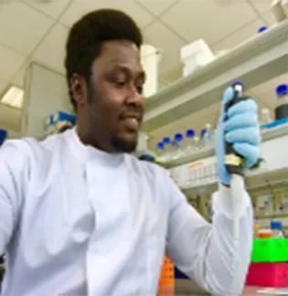Christopher Nwankwo working in the lab.