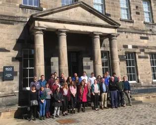 Photo of the Plant Clock research workshop participants in a group outside a building