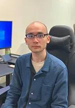 A portrait photograph of Dr Ryo Taniguchi