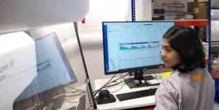 Scientist sitting at the FACSDiscover S8 cell sorter