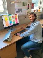 Jeremy Wyman sitting at computer