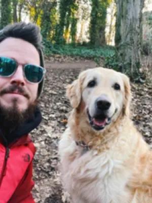 Photo of Michael McDonald outdoors with his dog