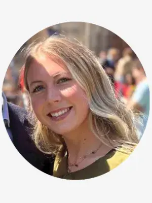 A young woman with blond hair smiling